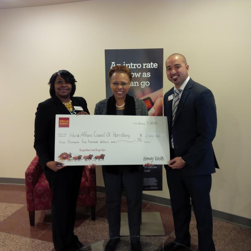 Council President Dr. Joyce M. Davis receives a check for $2500 from Demetta Dumeng, Store Manager and Assistant Vice President; and Roger Manalo, Assistant Vice President and Regional Banking District Manager.