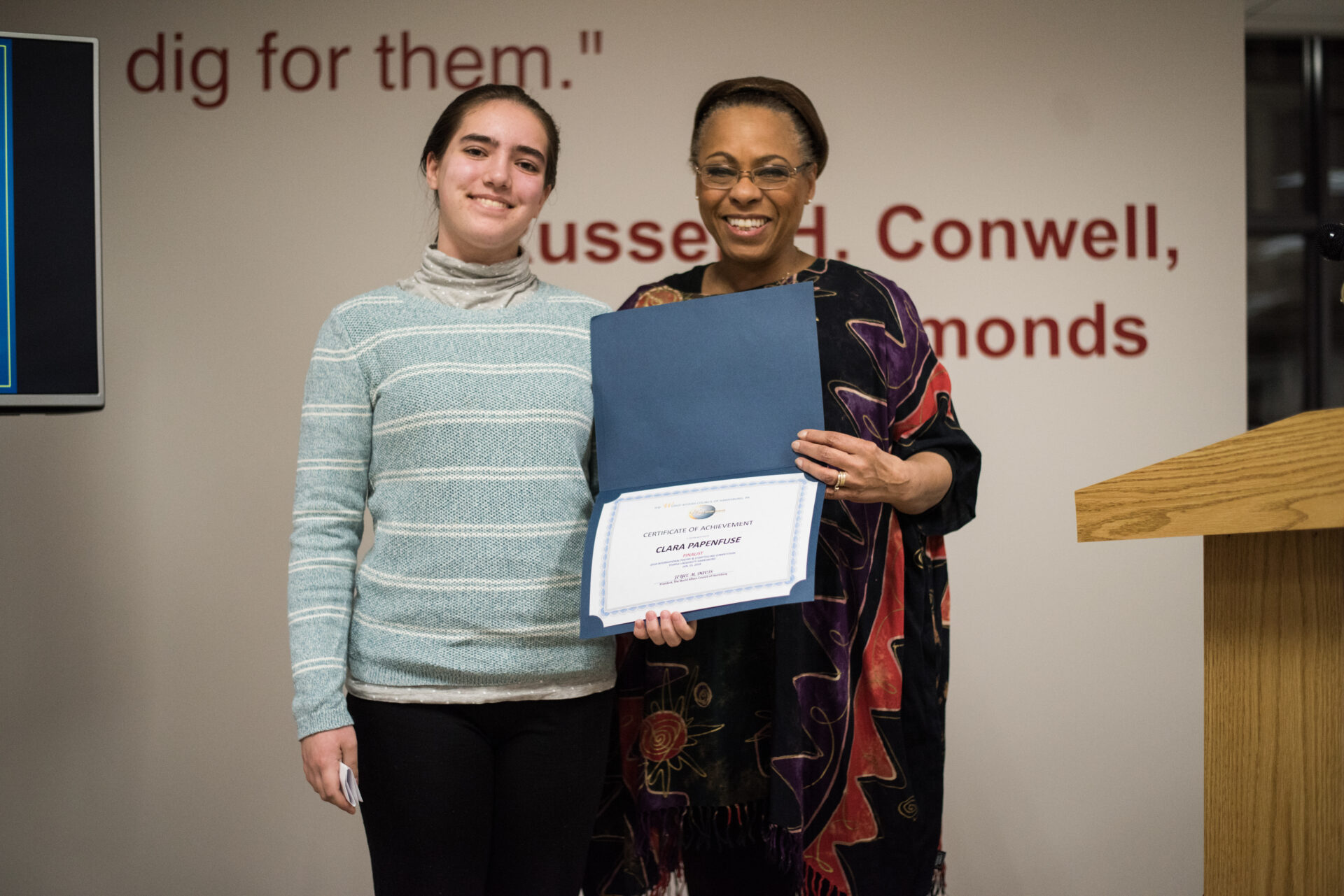 Clara Papenfuse receives her Finalist certificate in the 2018 International Poetry & Storytelling Competition.