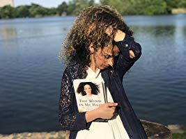 MASIH ALINEJAD holding her book