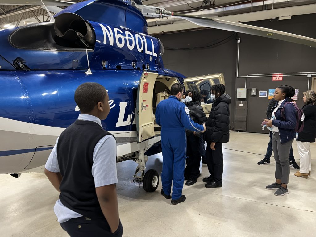 Global scholars looking at life lion helicopter