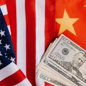 us & china flags with american currency