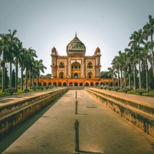 Explore the stunning Safdarjung Tomb in New Delhi, India, surrounded by lush gardens and palm trees.