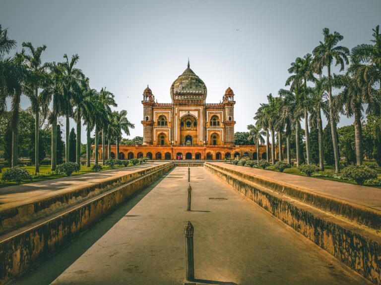 Explore the stunning Safdarjung Tomb in New Delhi, India, surrounded by lush gardens and palm trees.